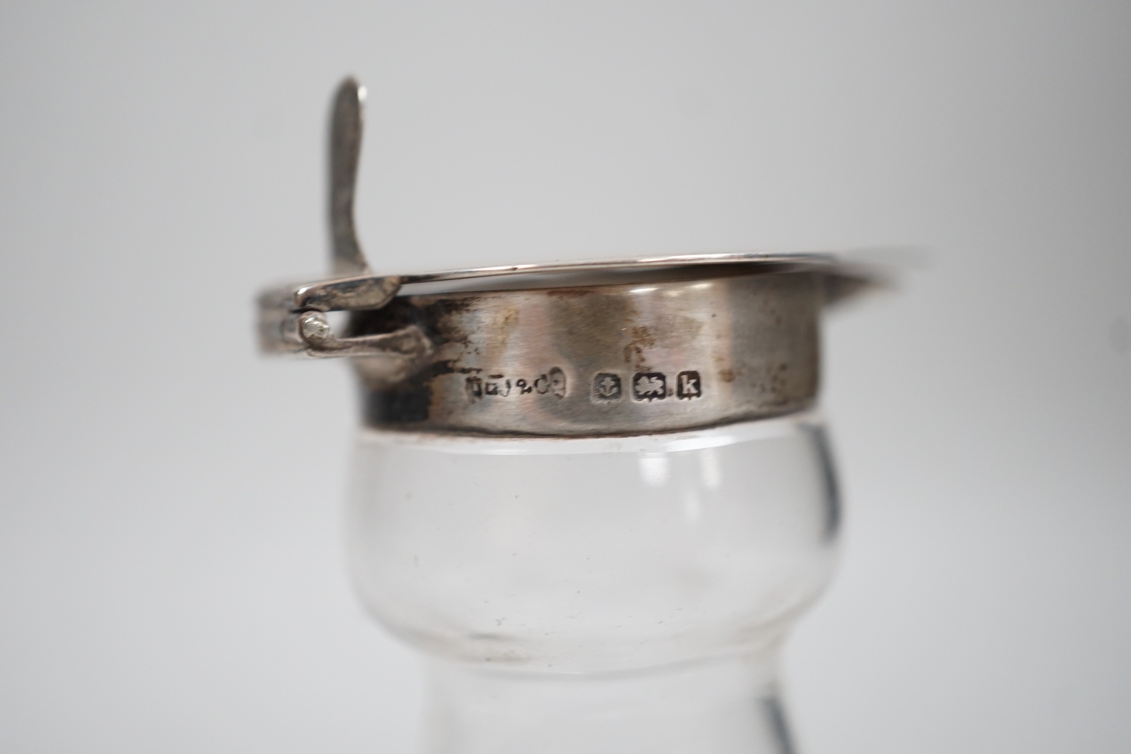 A set of four Edwardian silver mounted glass whisky noggins, H.B. Johnson & Co, Birmingham, 1909, height 12cm, together with a set of four silver whisky labels, same maker, London, 1910.